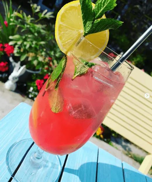 A watermelon mojito with lemon and mint